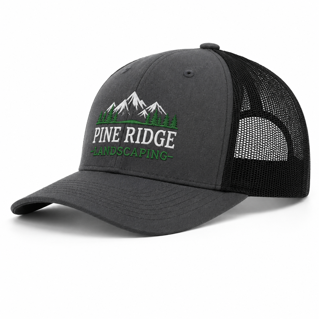 A dark gray and black trucker hat with a curved brim, featuring an embroidered logo of pine trees, mountains, and the text 'PINE RIDGE LANDSCAPING' on the front panel.